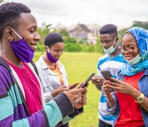 group-of-young-african-friends-with-facemasks-usin.jpg